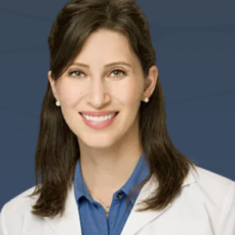 Portrait of a smiling female doctor in a white coat.
